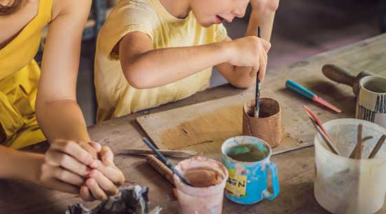 mother-son-doing-ceramic-pot-pottery-workshop-1