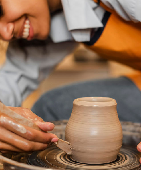 smiley-woman-doing-pottery-1